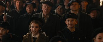 Movie still from “The Book Thief” (2013), directed by Brian Percival – A group of people standing in front of each other; Medium shot, Over the shoulder angle