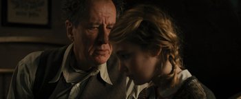 Movie still from “The Book Thief” (2013), directed by Brian Percival – An older man and a young woman looking at each other; Close Up shot, Over the shoulder angle