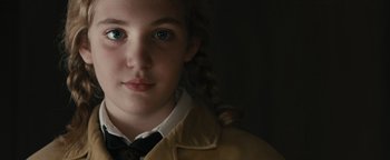 Movie still from “The Book Thief” (2013), directed by Brian Percival – A young girl wearing a jacket and tie; Close Up shot, Over the shoulder angle