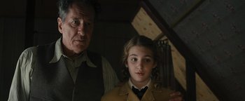 Movie still from “The Book Thief” (2013), directed by Brian Percival – An older man and a young girl standing next to each other; Close Up shot, Over the shoulder angle
