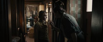 Movie still from “The Book Thief” (2013), directed by Brian Percival – A woman putting makeup on another woman's face; Medium shot, Over the shoulder angle