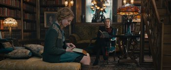 Movie still from “The Book Thief” (2013), directed by Brian Percival – Two women sitting in a living room reading books; Medium shot, Over the shoulder angle