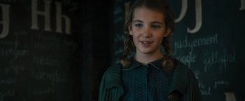 Movie still from “The Book Thief” (2013), directed by Brian Percival – A young girl in a green dress with pigtails; Close Up shot, Over the shoulder angle