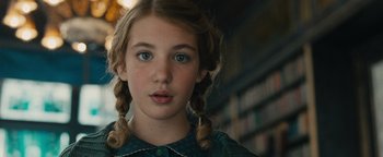 Movie still from “The Book Thief” (2013), directed by Brian Percival – A young girl with pigtails is looking into the camera; Close Up shot, Over the shoulder angle