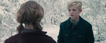 Movie still from “The Book Thief” (2013), directed by Brian Percival – Two people standing in front of each other in the snow; Close Up shot, Over the shoulder angle