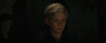 Movie still from “The Book Thief” (2013), directed by Brian Percival – A young boy with blonde hair stares into the camera; Close Up shot, High angle