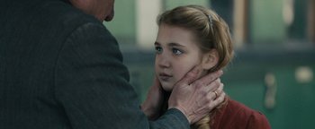 Movie still from “The Book Thief” (2013), directed by Brian Percival – An older man touching the neck of a young girl; Close Up shot, Over the shoulder angle