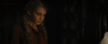 Movie still from “The Book Thief” (2013), directed by Brian Percival – A young girl with long hair is posing for a picture; Close Up shot, High angle