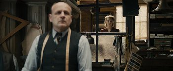 Movie still from “The Book Thief” (2013), directed by Brian Percival – A man and a woman looking out of a window; Medium shot, Over the shoulder angle
