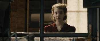 Movie still from “The Book Thief” (2013), directed by Brian Percival – A young woman looking out of a window; Close Up shot, Over the shoulder angle