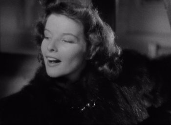 Movie still from “Bringing Up Baby” (1938), directed by Howard Hawks – An old photo of a woman in a fur coat; Close Up shot, Low angle