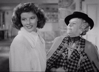 Movie still from “Bringing Up Baby” (1938), directed by Howard Hawks – An old photo of a woman and an older woman; Medium shot, Over the shoulder angle