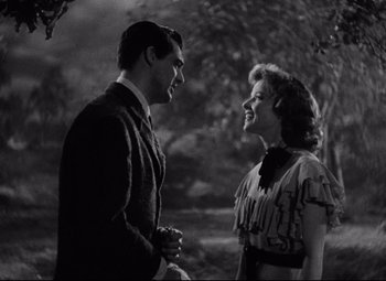 Movie still from “Bringing Up Baby” (1938), directed by Howard Hawks – A man and a woman talking to each other; Medium shot, Over the shoulder angle