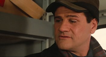 Movie still from “Broadcast News” (1987), directed by James L. Brooks – A person wearing a hat; Close Up shot, Low angle
