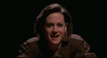 Movie still from “Broadcast News” (1987), directed by James L. Brooks – A person with short brown hair; Close Up shot, Low angle