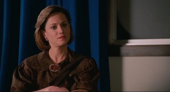 Movie still from “Broadcast News” (1987), directed by James L. Brooks – A person sitting in a room; Close Up shot, Over the shoulder angle