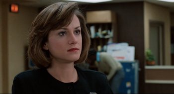 Movie still from “Broadcast News” (1987), directed by James L. Brooks – A person with short hair; Close Up shot, Over the shoulder angle