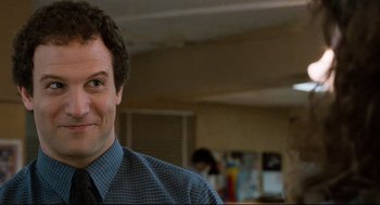 Movie still from “Broadcast News” (1987), directed by James L. Brooks – A person wearing a shirt and a tie; Close Up shot, Over the shoulder angle