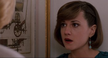 Movie still from “Broadcast News” (1987), directed by James L. Brooks – A person with short brown hair; Close Up shot, Over the shoulder angle