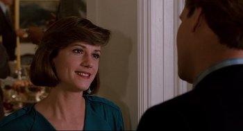 Movie still from “Broadcast News” (1987), directed by James L. Brooks – A woman in a green shirt is talking to a man; Close Up shot, Over the shoulder angle