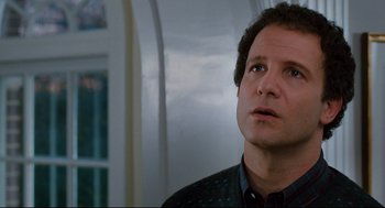 Movie still from “Broadcast News” (1987), directed by James L. Brooks – A person looking up at the sky; Close Up shot, Low angle
