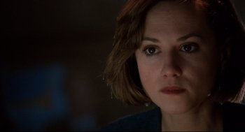 Movie still from “Broadcast News” (1987), directed by James L. Brooks – A person with short hair; Close Up shot, Over the shoulder angle