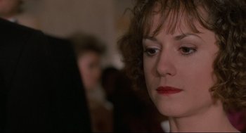 Movie still from “Broadcast News” (1987), directed by James L. Brooks – A person wearing a red lipstick; Close Up shot, Over the shoulder angle