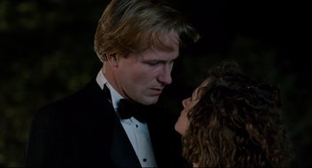 Movie still from “Broadcast News” (1987), directed by James L. Brooks – A man and a woman dressed in formal wear; Close Up shot, Low angle