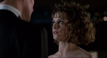 Movie still from “Broadcast News” (1987), directed by James L. Brooks – A man and a woman are looking at one another; Close Up shot, Over the shoulder angle