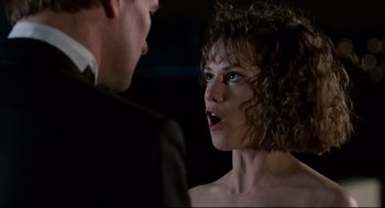 Movie still from “Broadcast News” (1987), directed by James L. Brooks – A man and a woman talking to each other; Close Up shot, Over the shoulder angle