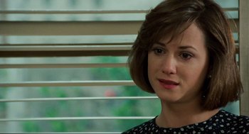 Movie still from “Broadcast News” (1987), directed by James L. Brooks – A person sitting in front of a window; Close Up shot, Over the shoulder angle