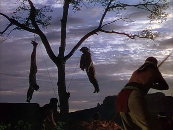 Movie still from “Broken Arrow” (1950), directed by Delmer Daves – A group of people hanging from a tree; Wide shot, Low angle