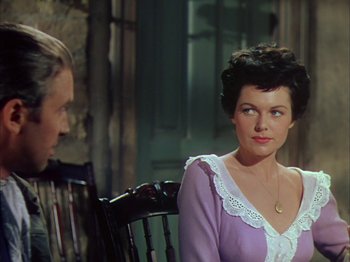 Movie still from “Broken Arrow” (1950), directed by Delmer Daves – A woman sitting next to a man on a chair; Medium shot, Over the shoulder angle