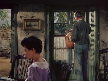 Movie still from “Broken Arrow” (1950), directed by Delmer Daves – An older man and a young woman in a room; Wide shot, Low angle