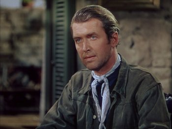 Movie still from “Broken Arrow” (1950), directed by Delmer Daves – A person wearing a suit and tie; Close Up shot, Over the shoulder angle