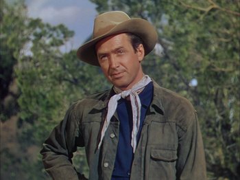 Movie still from “Broken Arrow” (1950), directed by Delmer Daves – A man wearing a cowboy hat and a tie; Medium shot, Low angle