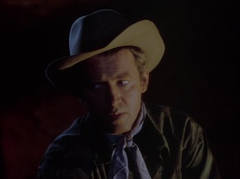 Movie still from “Broken Arrow” (1950), directed by Delmer Daves – A person wearing a hat; Close Up shot, Over the shoulder angle