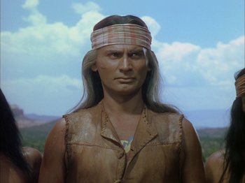 Movie still from “Broken Arrow” (1950), directed by Delmer Daves – A man in a native american costume with long white hair; Close Up shot, Low angle