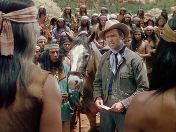 Movie still from “Broken Arrow” (1950), directed by Delmer Daves – A group of men standing next to each other; Medium shot, Over the shoulder angle