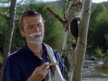 Movie still from “Broken Arrow” (1950), directed by Delmer Daves – A man with a shaving cream on his face; Close Up shot, Over the shoulder angle