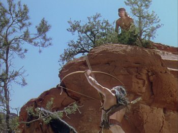 Movie still from “Broken Arrow” (1950), directed by Delmer Daves – Two native american men on top of a mountain; Wide shot, Low angle