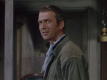 Movie still from “Broken Arrow” (1950), directed by Delmer Daves – A person wearing a jacket and a tie; Close Up shot, Over the shoulder angle