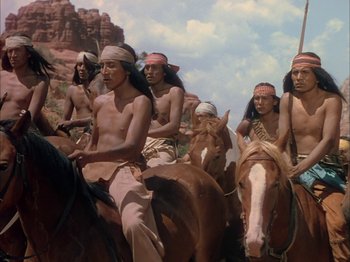 Movie still from “Broken Arrow” (1950), directed by Delmer Daves – A group of native american men riding on horses; Wide shot, Low angle