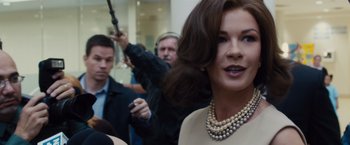 Movie still from “Broken City” (2013), directed by Allen Hughes – A person wearing a necklace; Close Up shot, Over the shoulder angle