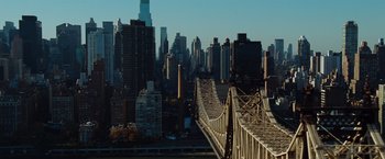 Movie still from “Broken City” (2013), directed by Allen Hughes – A view of a bridge and a city skyline; Extreme Wide shot, Low angle
