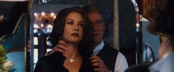 Movie still from “Broken City” (2013), directed by Allen Hughes – A man and a woman standing next to each other; Close Up shot, Over the shoulder angle
