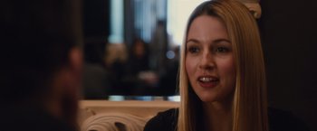 Movie still from “Broken City” (2013), directed by Allen Hughes – A person sitting in a room; Close Up shot, Over the shoulder angle