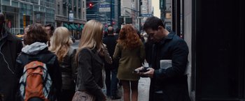 Movie still from “Broken City” (2013), directed by Allen Hughes – A man and a woman standing on the sidewalk; Medium shot, Over the shoulder angle