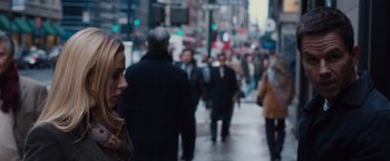 Movie still from “Broken City” (2013), directed by Allen Hughes – A crowd of people walking down a street; Close Up shot, Over the shoulder angle