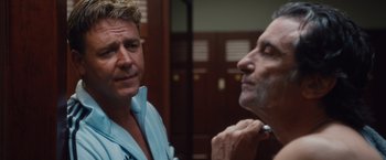 Movie still from “Broken City” (2013), directed by Allen Hughes – A man looking at another man while he shaves his beard; Close Up shot, Over the shoulder angle